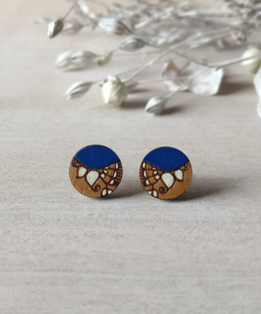 boho wooden earrings in royal blue color mini round on background
