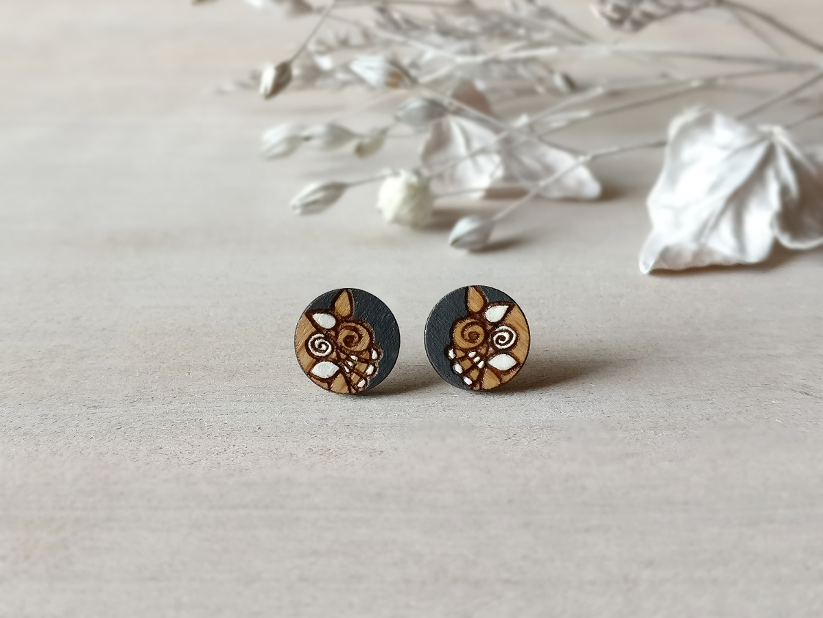 chic wooden earrings in grey color mini round on background