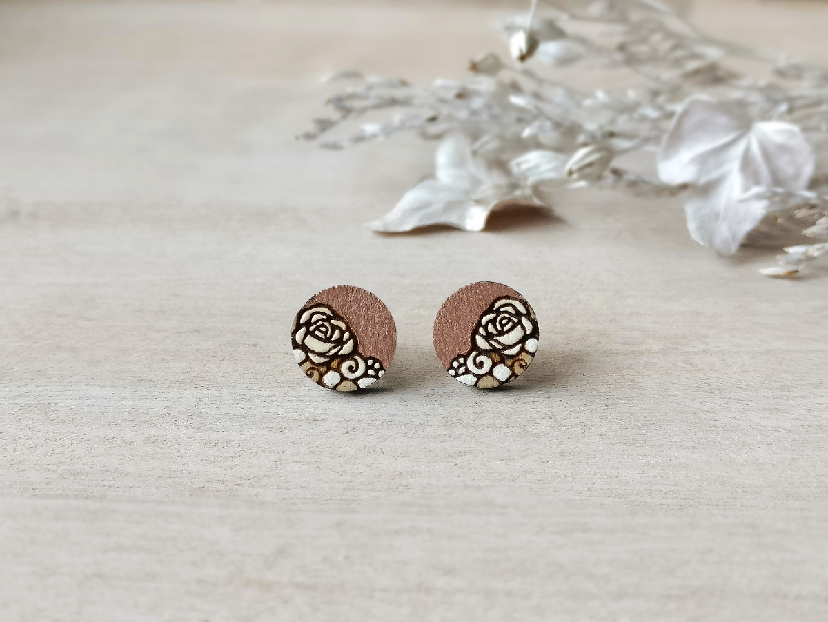 chic wooden studs in rose gold color mini round on background