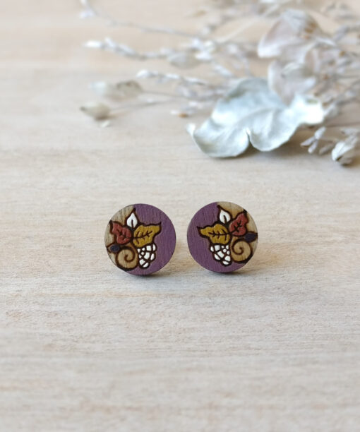 colorful wooden studs in purple color mini round on background