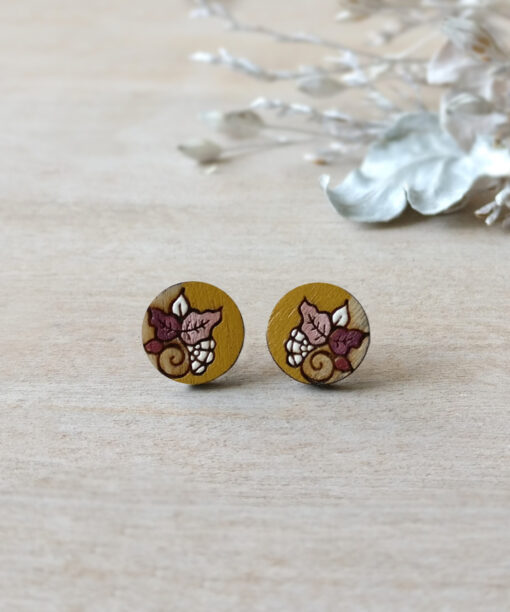 detailed wooden studs in ochre color mini round on background