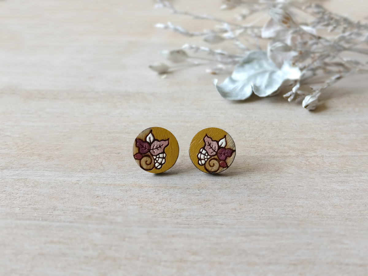 detailed wooden studs in ochre color mini round on background