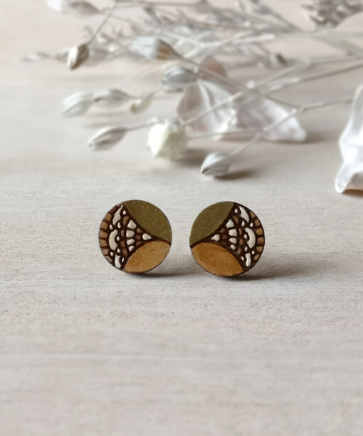gold wooden earrings mini round on background