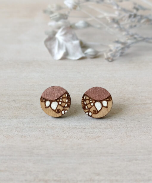 handmade wooden studs in rose gold color mini round on background