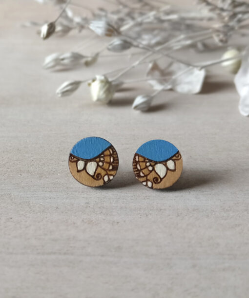 lightweight wooden studs in blue color mini round on background