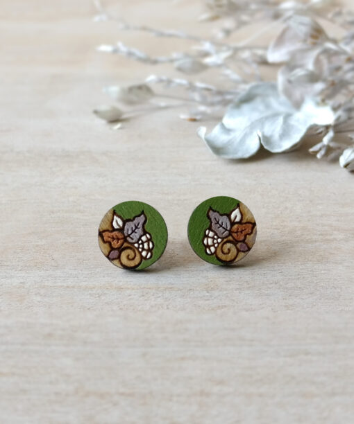 retro wooden studs in green color mini round on background
