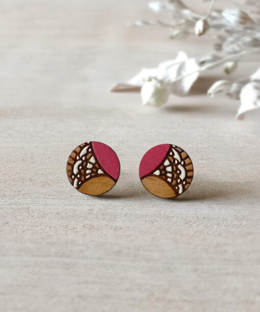 vintage wooden earrings in pink color mini round on background