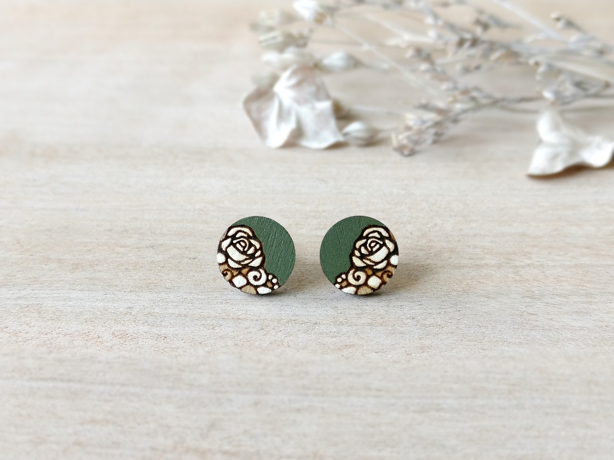 vintage wooden studs in green color mini round on background
