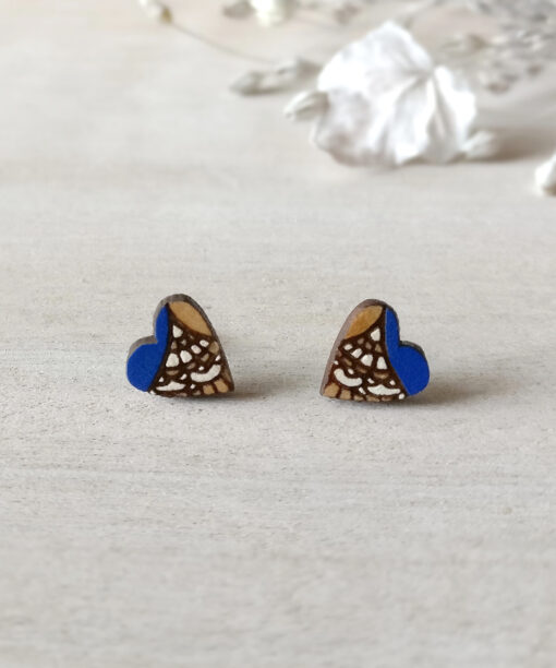 boho wooden heart earrings in royal blue color on background