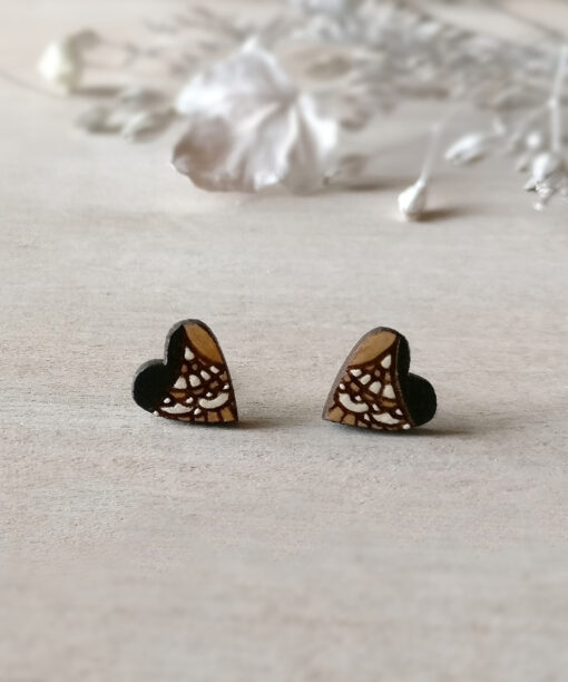 lovely wooden heart earrings in black color on background