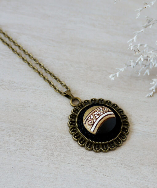 black wooden necklace on background