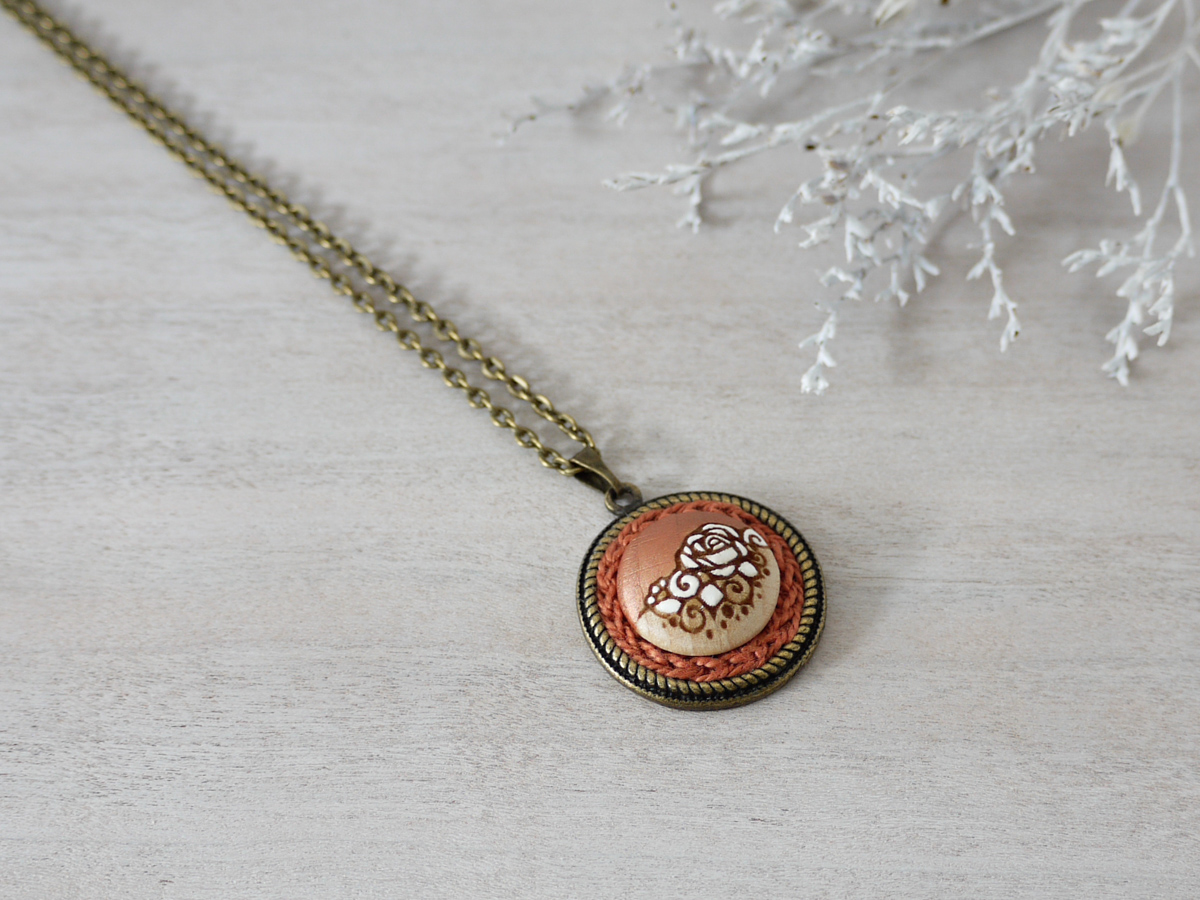 copper wooden necklace on background