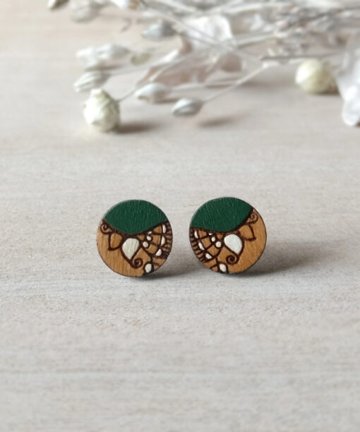 dark green wooden earrings mini round on background