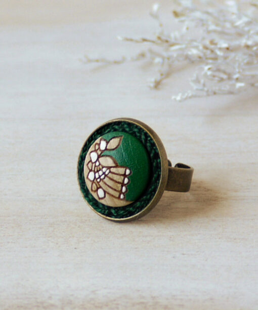small green wooden ring on background