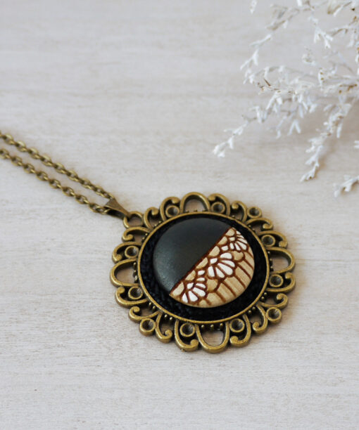 medium black wooden necklace on background