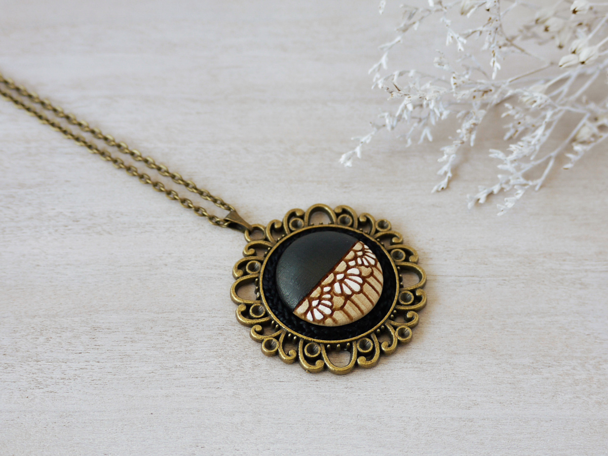 medium black wooden necklace on background