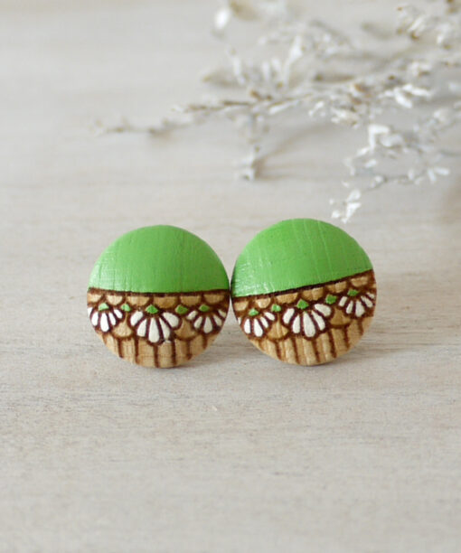 medium handmade wooden earrings green on background
