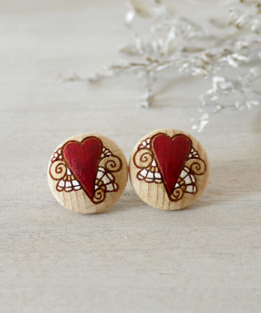 medium lovely wooden earrings on background