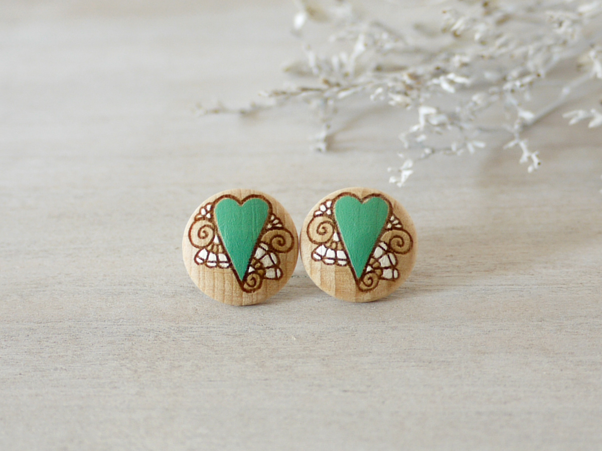 medium mint wooden earrings on background
