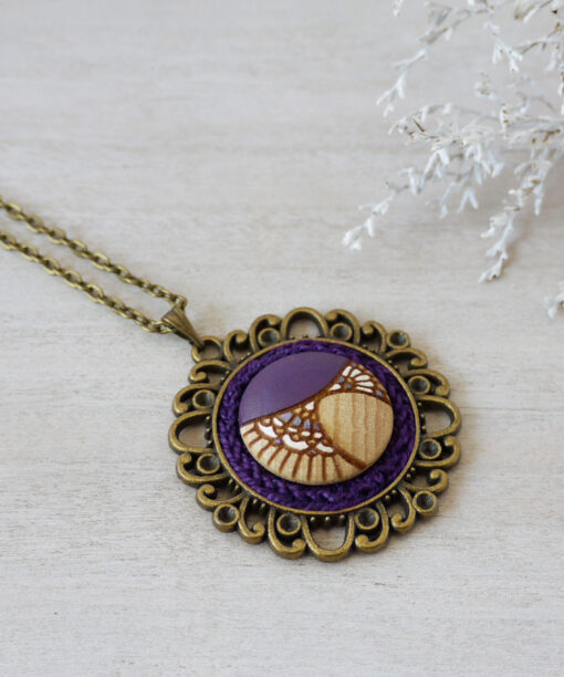 medium purple wooden necklace on background