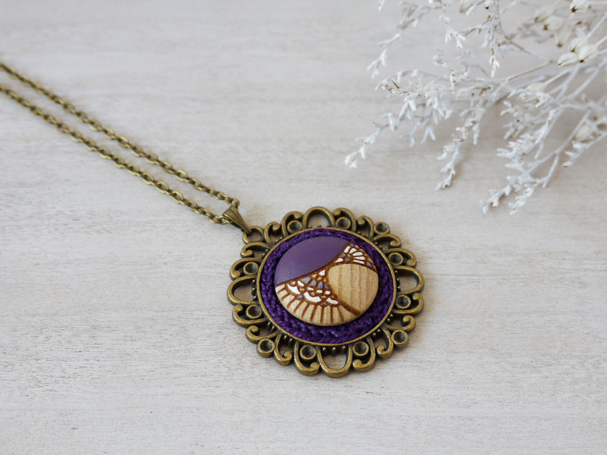 medium purple wooden necklace on background