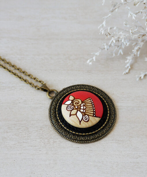 medium red wooden necklace on background
