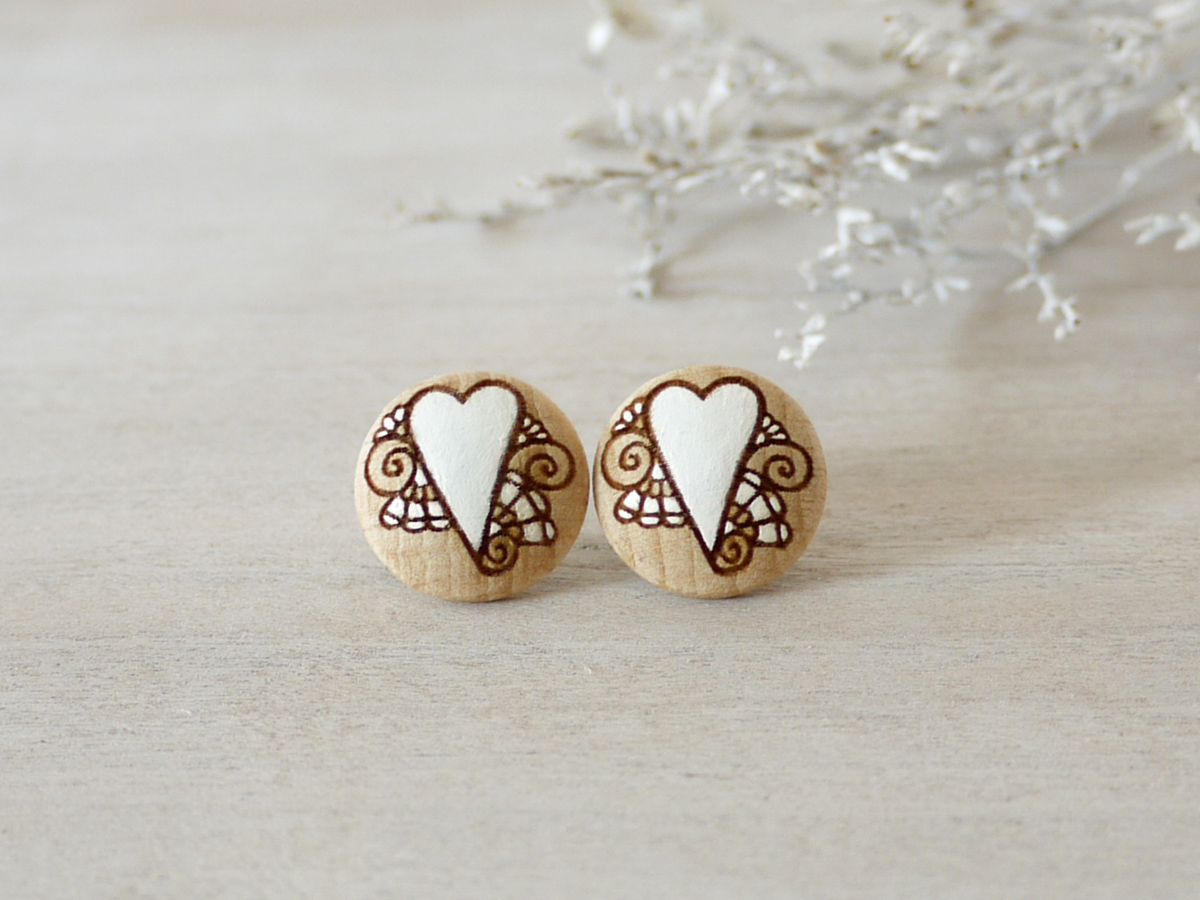 medium romantic wooden earrings on background