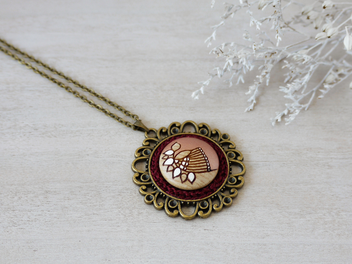 medium rose gold wooden necklace on background