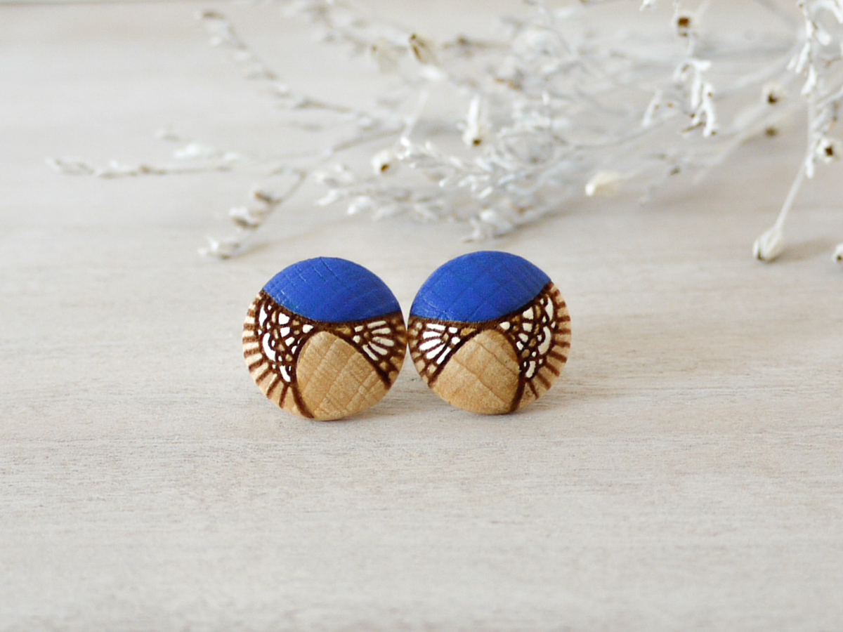 medium royal blue wooden earrings on background
