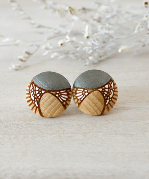 medium silver wooden earrings on background
