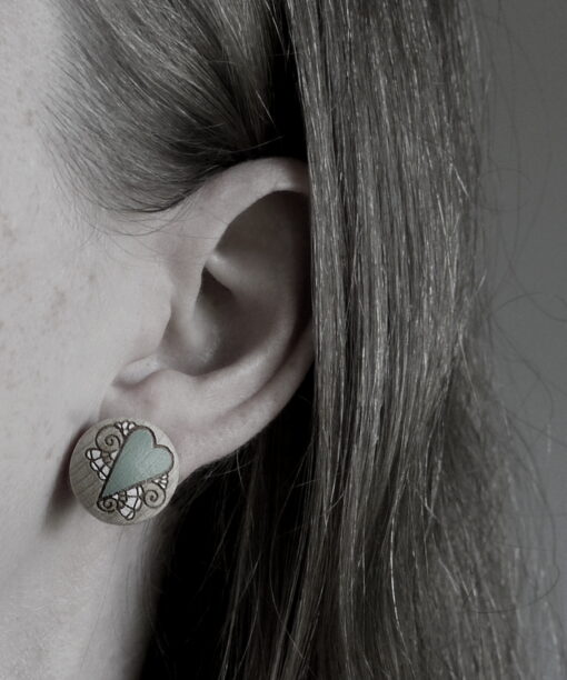 medium wooden earrings heart design on model
