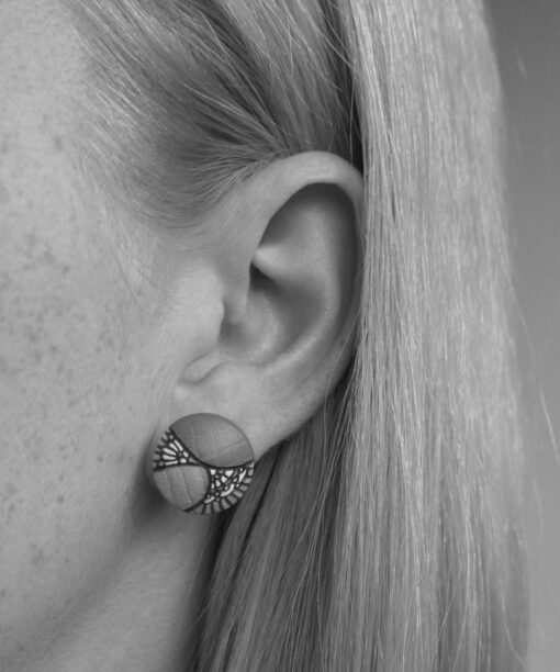 medium wooden earrings lace design on model