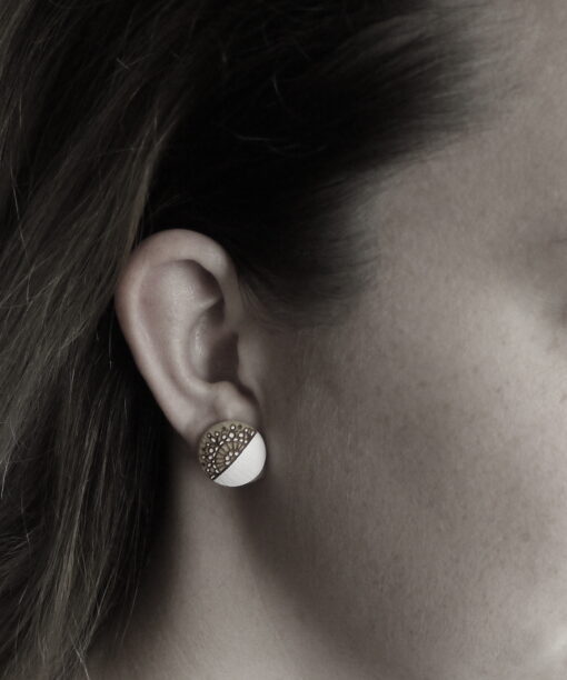 medium wooden earrings snowflake design on model