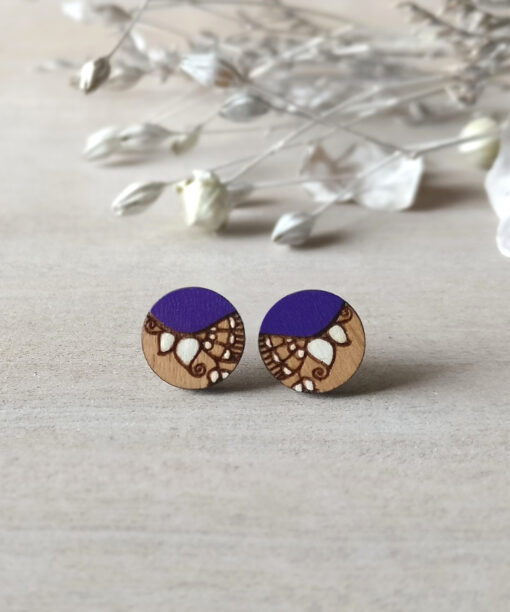 purple wooden earrings mini round on background
