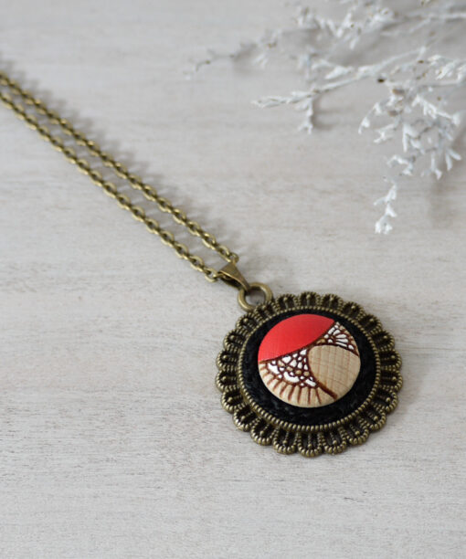 red wooden necklace on background
