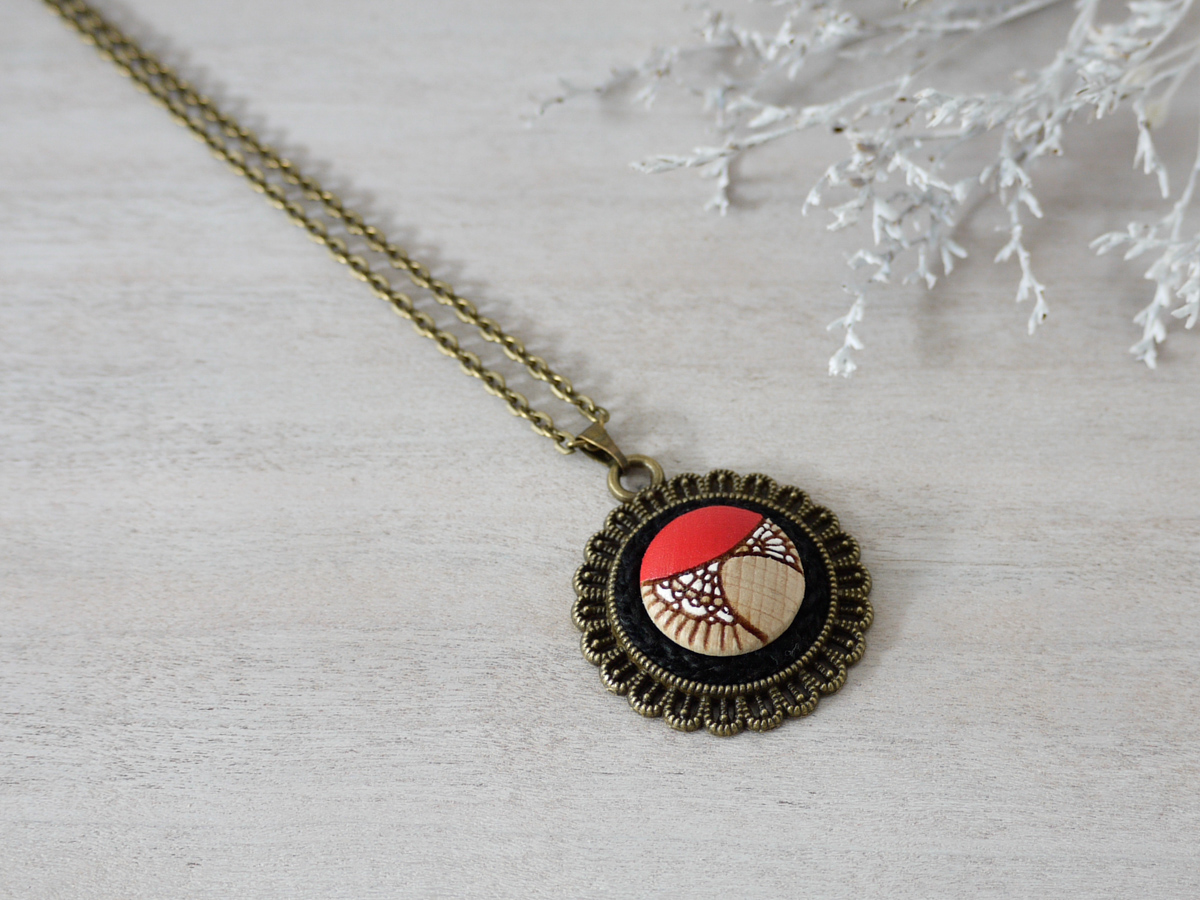 red wooden necklace on background