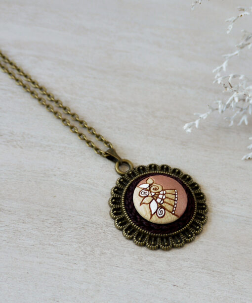 rose gold wooden necklace on background