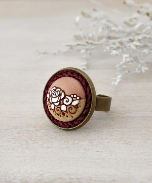 rose gold wooden ring on background