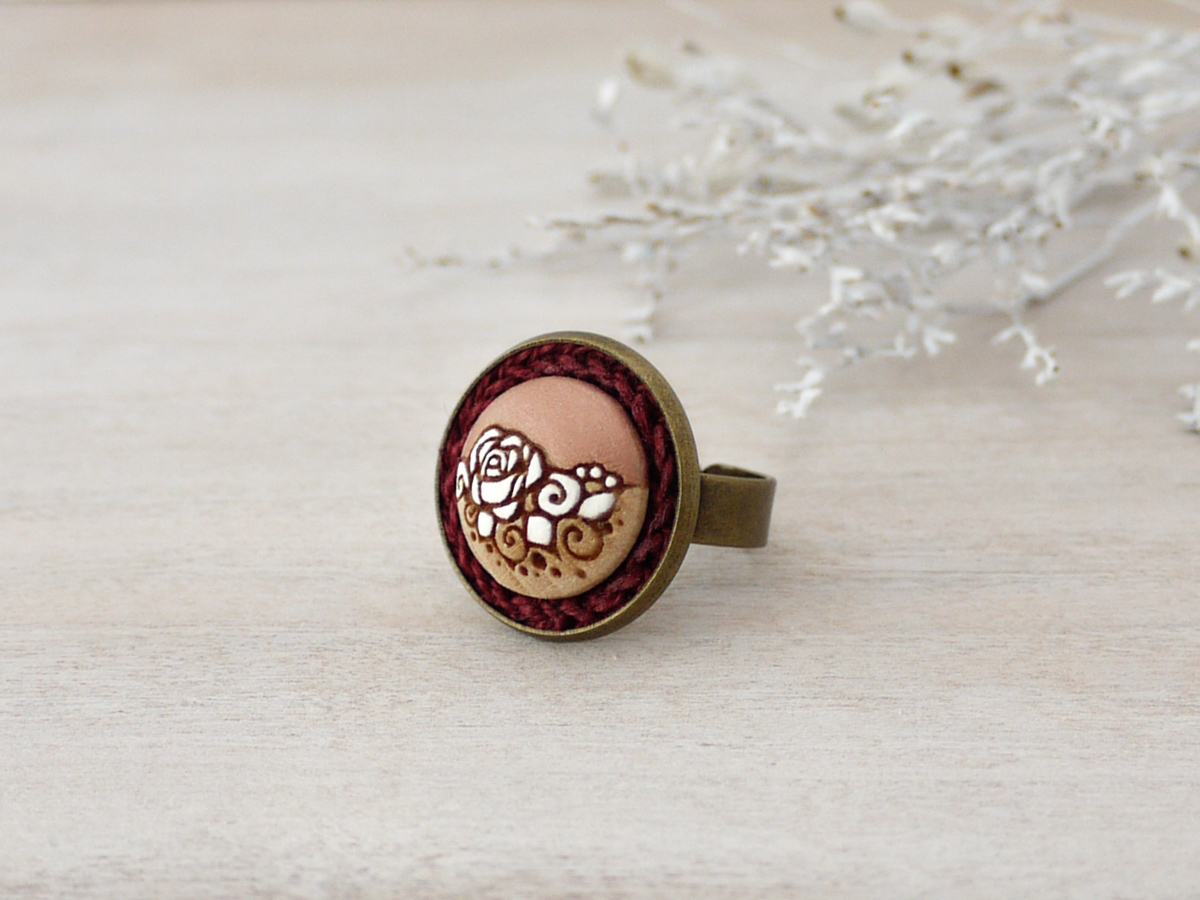rose gold wooden ring on background