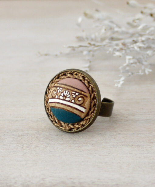 teal wooden ring on background