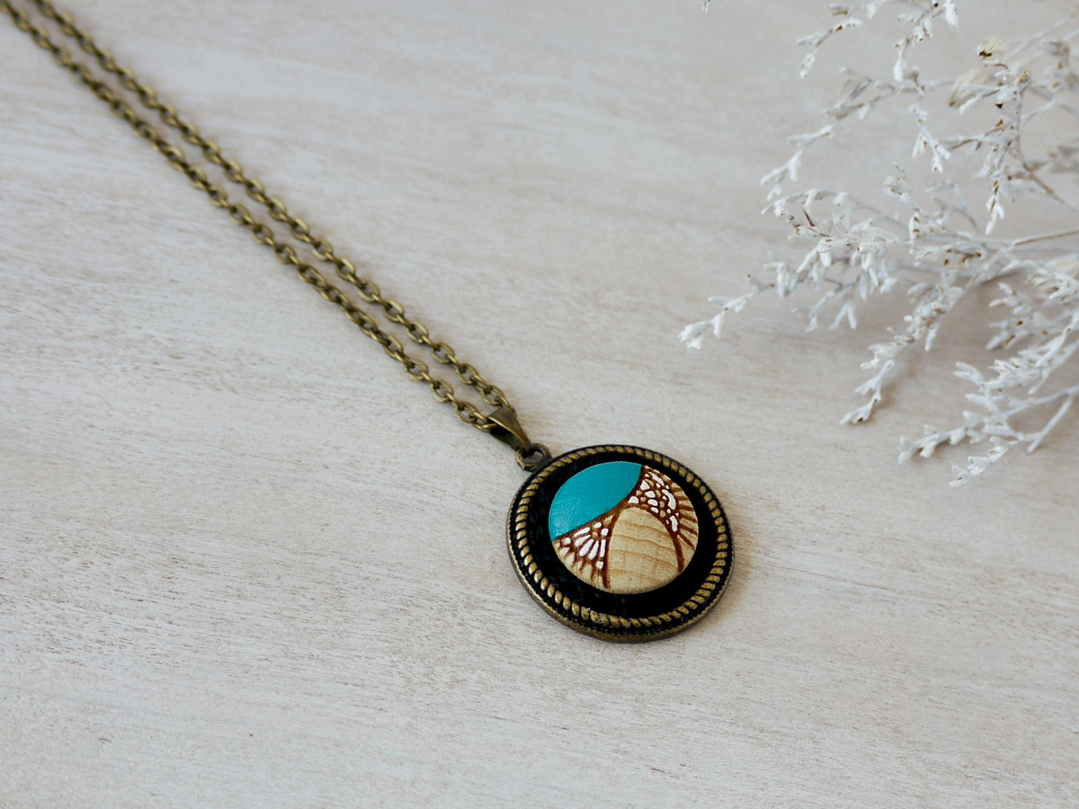 turquoise wooden necklace on background