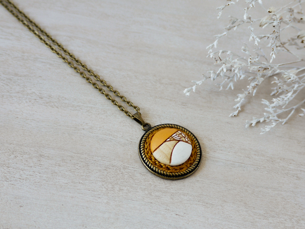 yellow wooden necklace on background