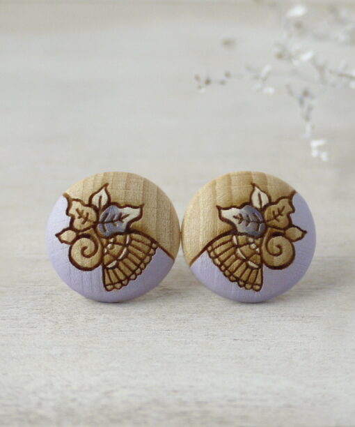 lovely wooden earrings in purple color large on background