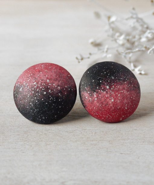 large pink night sky wooden earrings on background