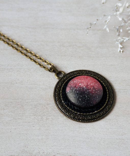 medium pink night sky wooden necklace on background