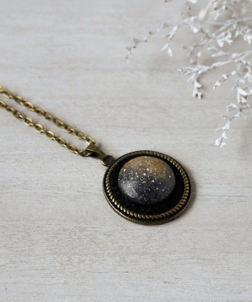 small ochre night sky wooden necklace on background