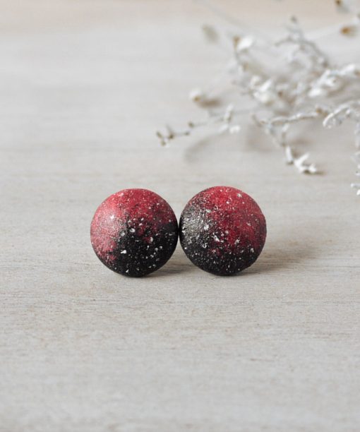 small pink night sky wooden earrings on background
