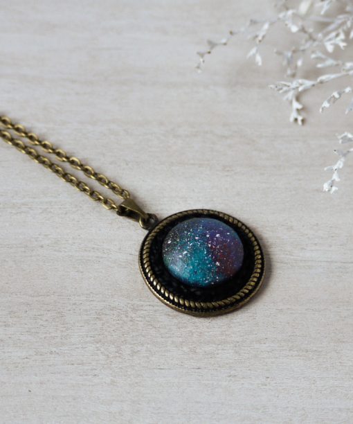 small purple night sky wooden necklace on background