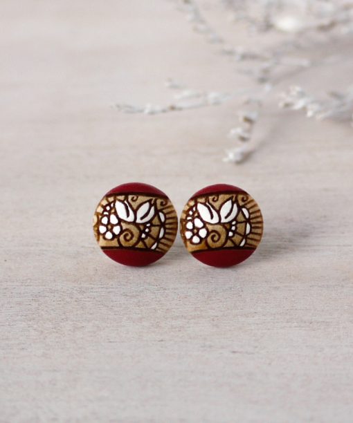 small wooden studs in dark red color on background
