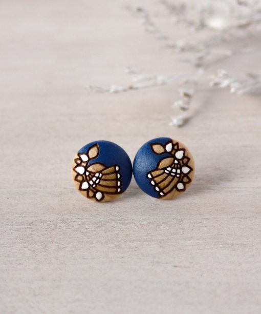 small wooden studs in navy blue color on background